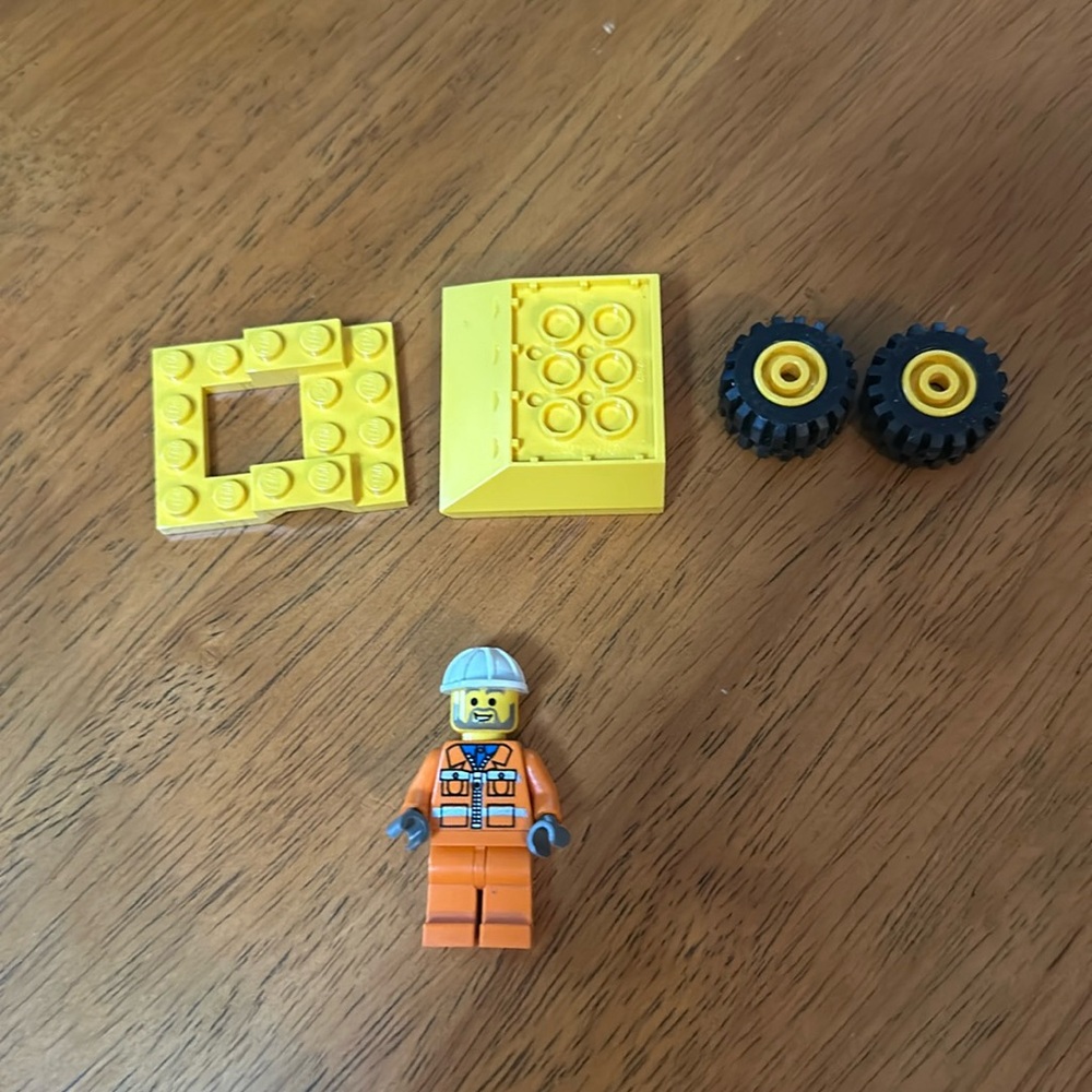 Lego mini figurine Lego town city mini dump truck driver. Has original face/hat